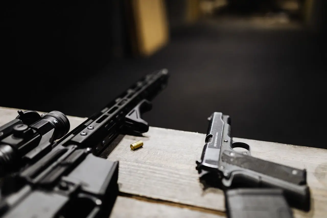 Firearms secured on a workbench at an indoor range